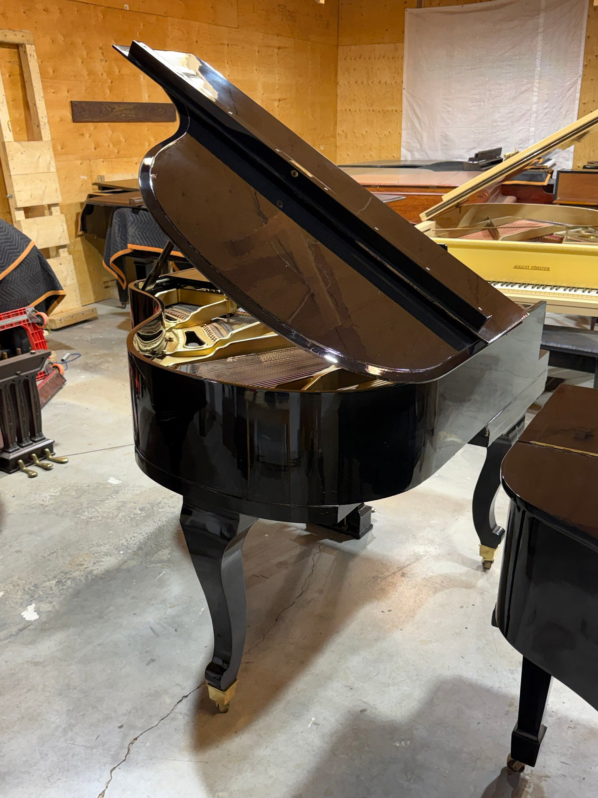 Cunningham grand piano case and curved legs, rear view