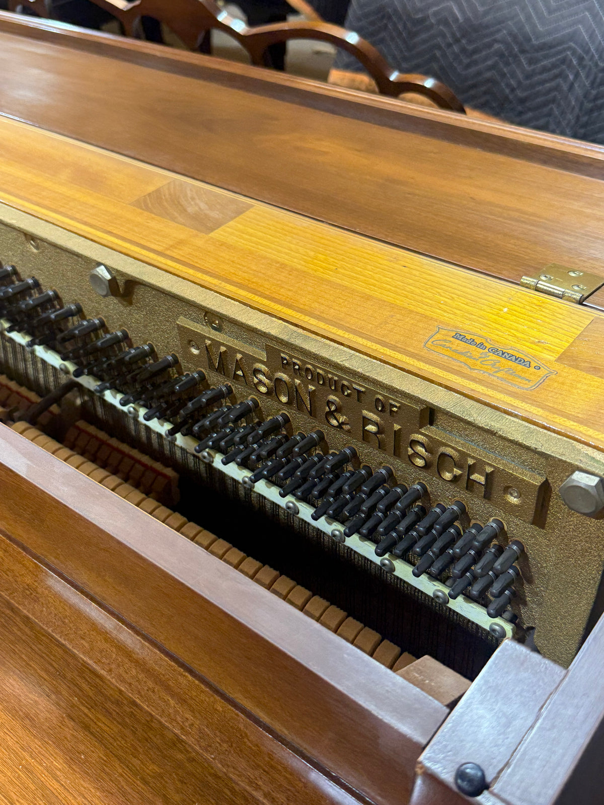 Inside the Mason & Risch piano, cast iron plate made in Canada