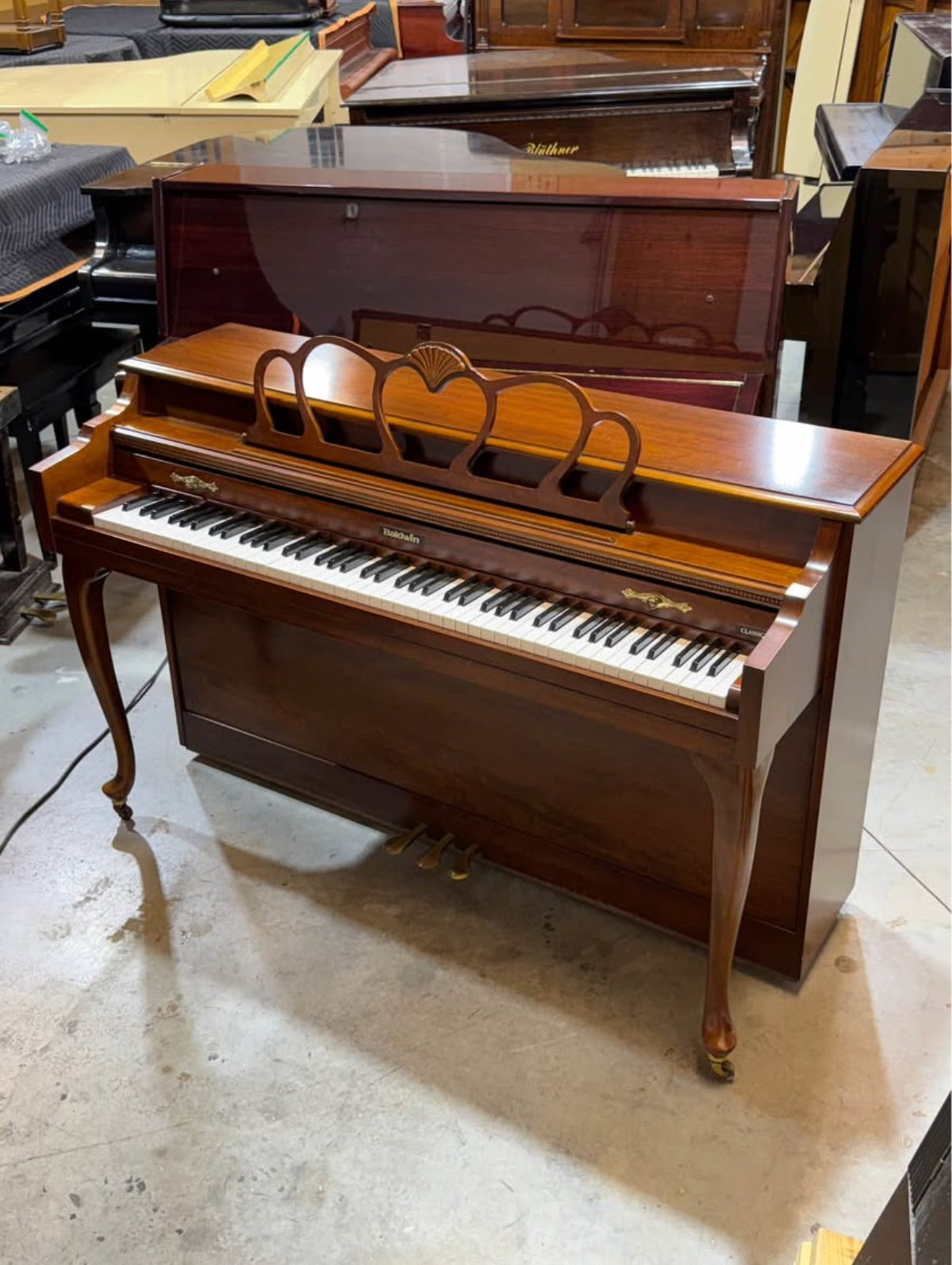 Baldwin Classic walnut console piano side view