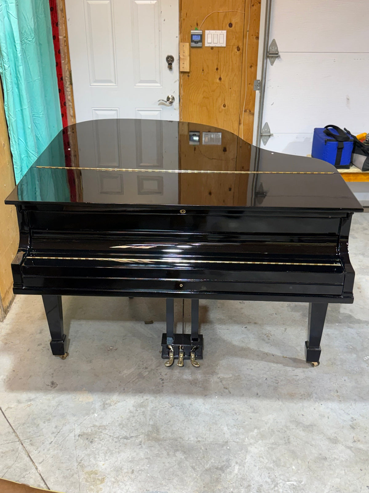 Baldwin grand with fallboard closed, polished ebony