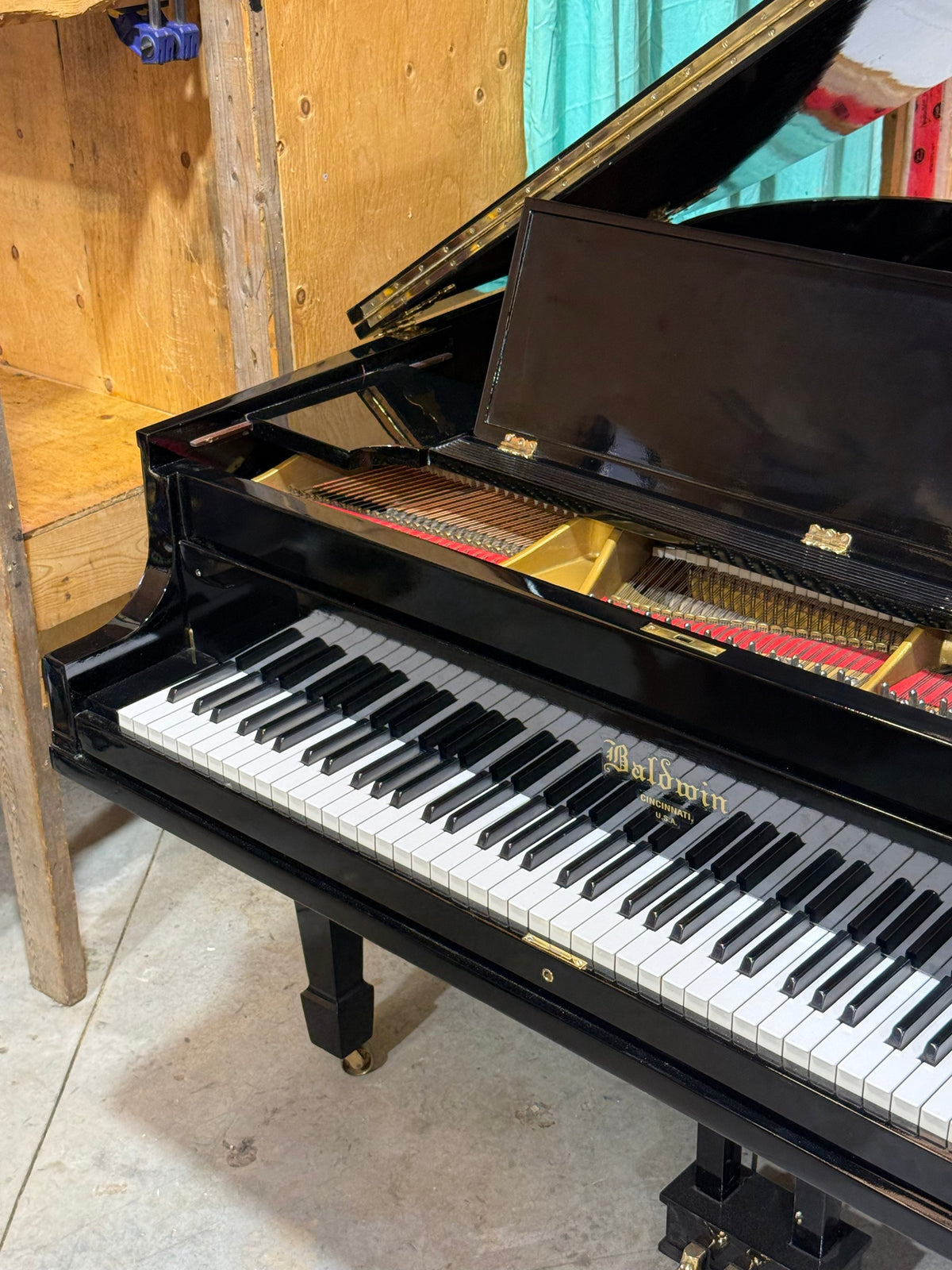 Baldwin grand keyboard and music desk