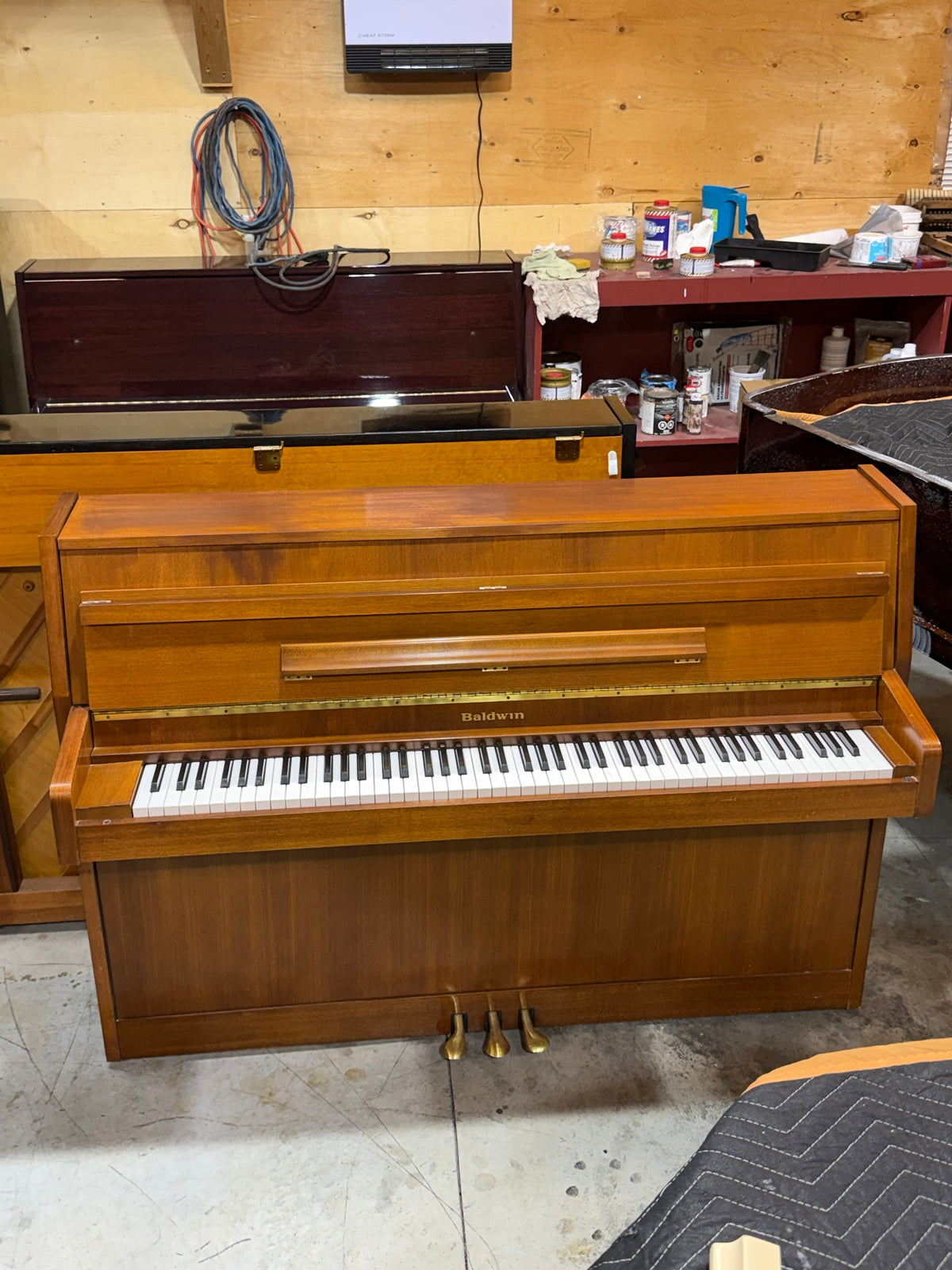 Front view of the Baldwin walnut upright piano
