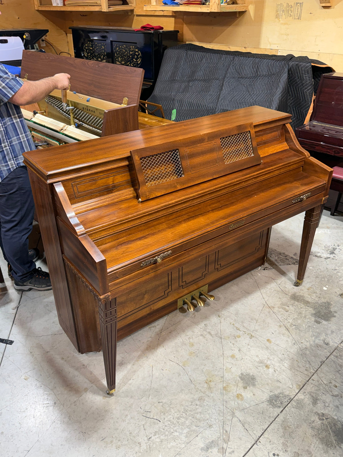 Currier walnut console piano side view