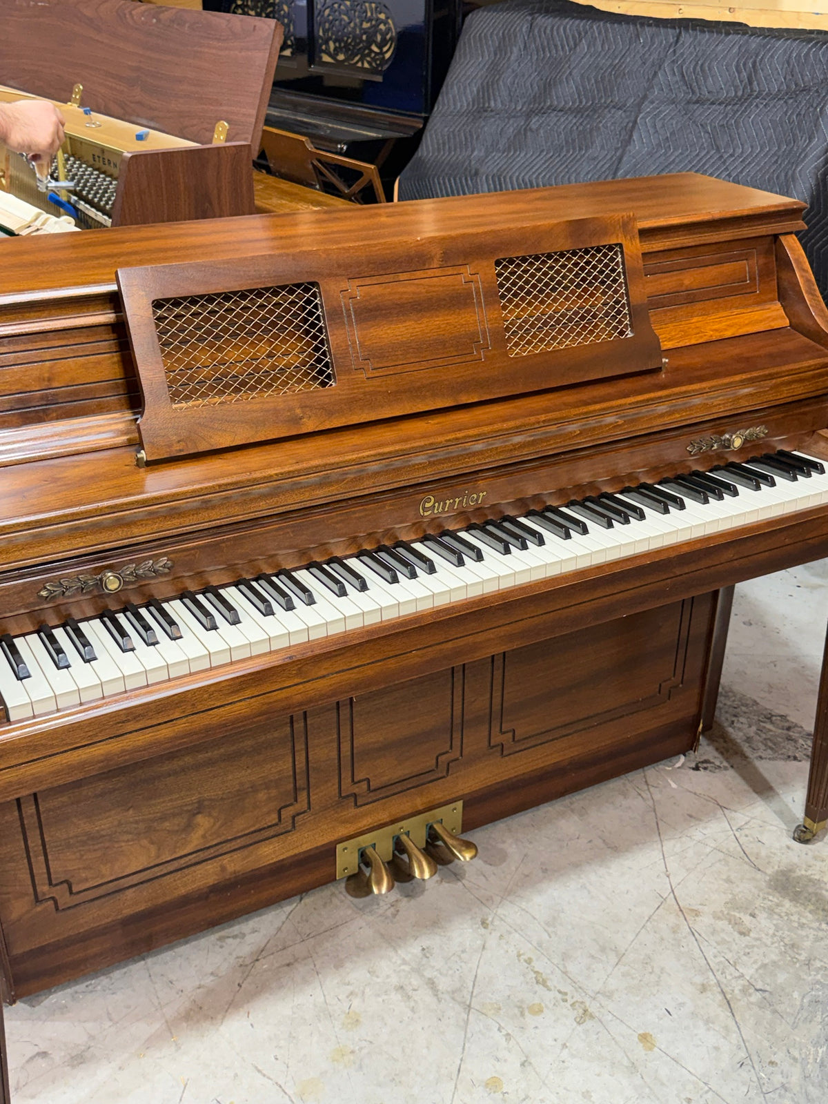 Currier piano keyboard with brass trim