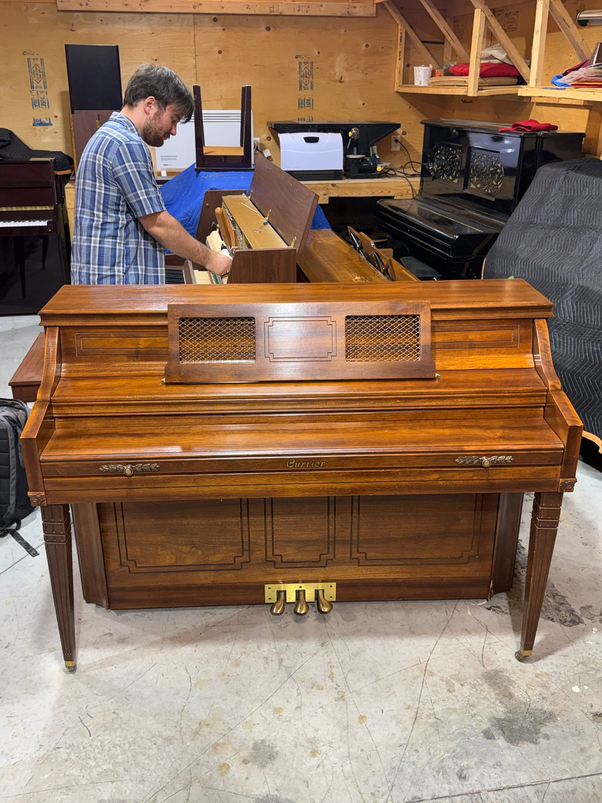 Currier console piano with fallboard closed, front view