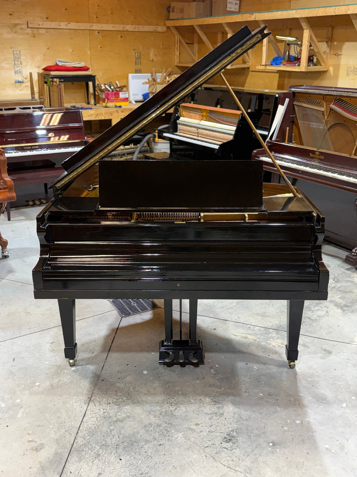Heintzman grand piano front view, lid open