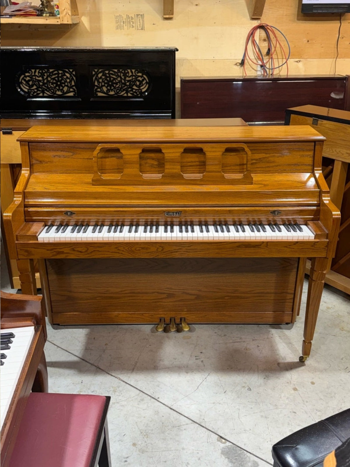 Front view of the Kimball oak console piano