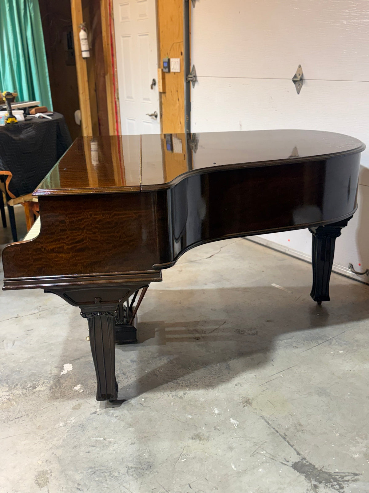 Mason & Risch grand piano side view, figured mahogany