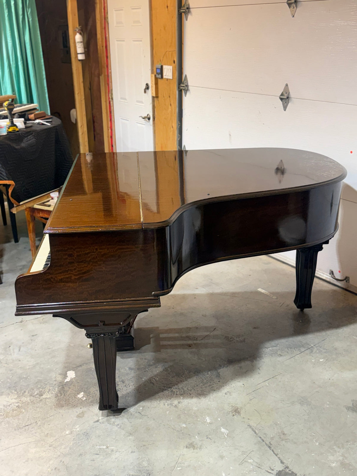 Refinished mahogany case of the Mason & Risch grand