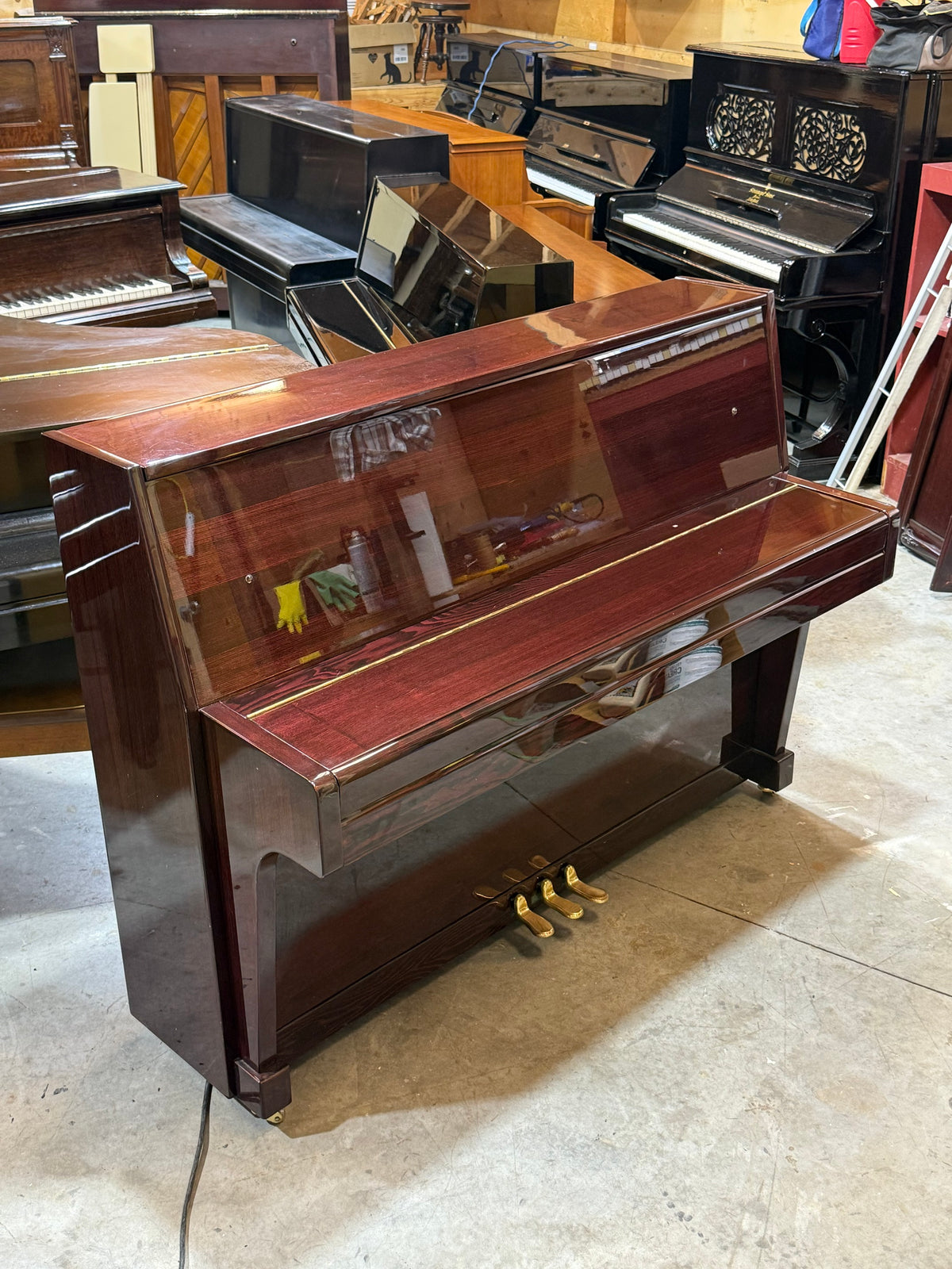 Used Strauss mahogany upright piano, fallboard closed