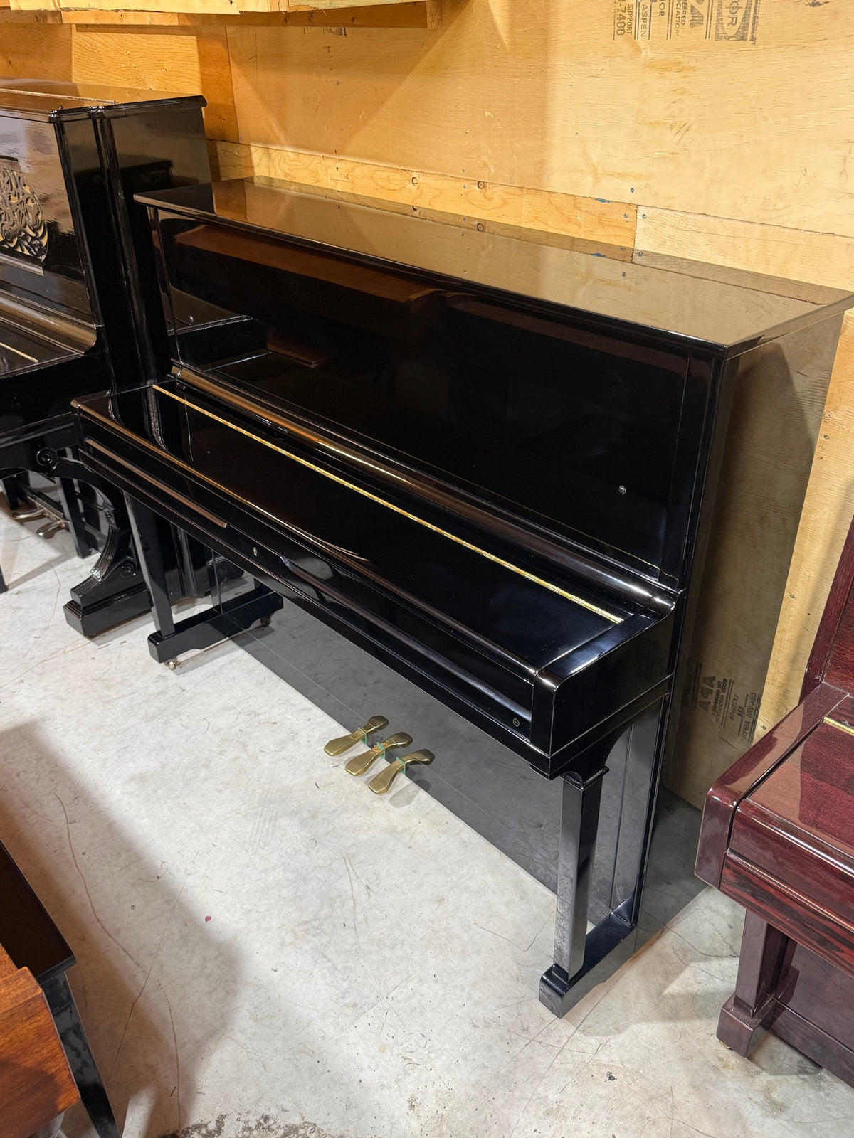Used Young Chang black upright piano, fallboard closed