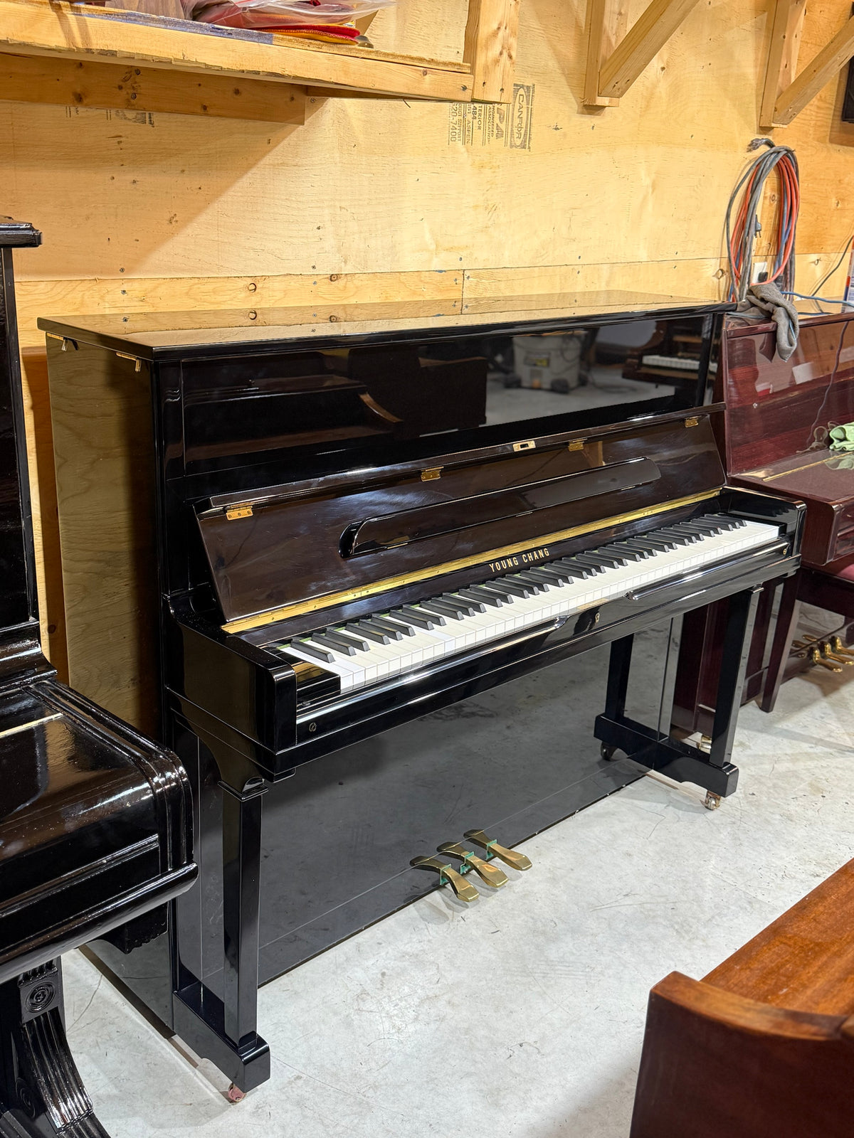 Young Chang E-118 upright piano with keyboard open