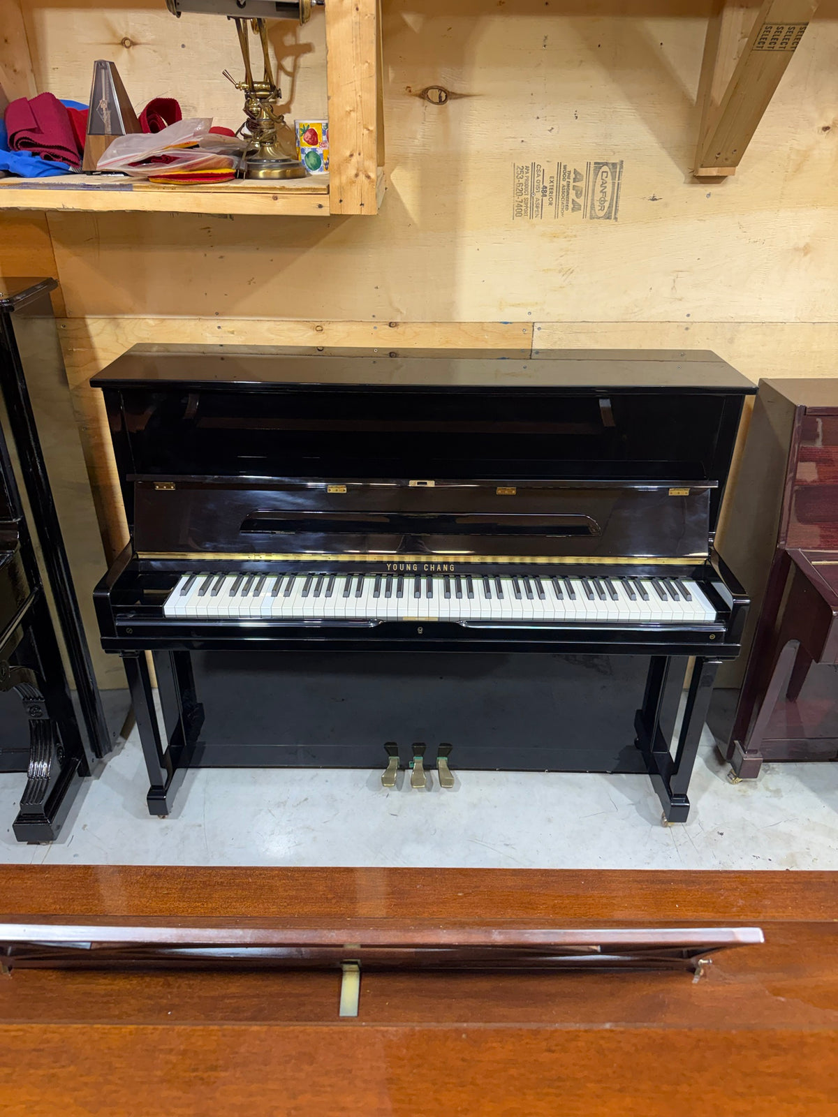 Front view of the Young Chang E-118 upright piano